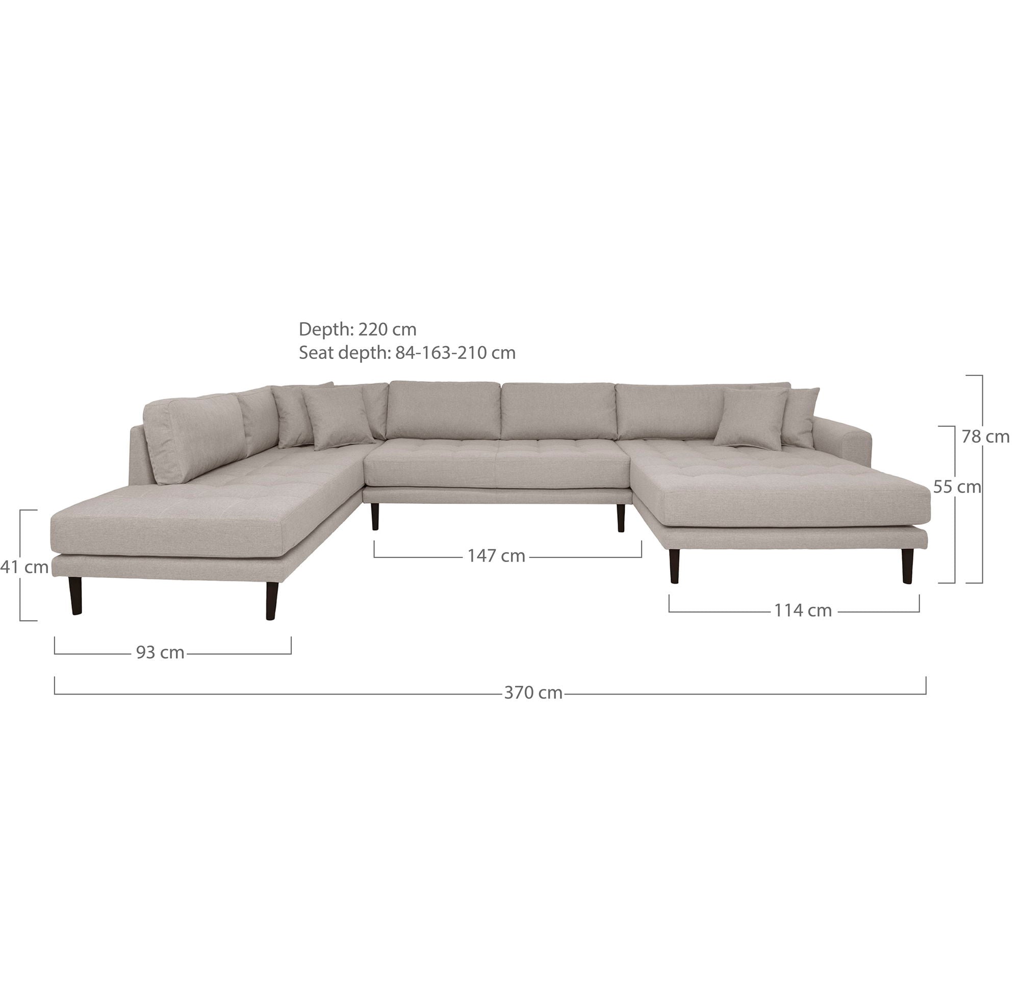 facing right in stone with four cushions and black wooden legs
